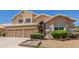 Charming two-story home with a three-car garage and a well-manicured front lawn at 728 W Sandra Ter, Phoenix, AZ 85023