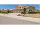Inviting two-story home featuring a three-car garage and well-maintained front yard landscaping at 728 W Sandra Ter, Phoenix, AZ 85023