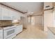 Well-lit kitchen featuring white cabinetry and sleek appliances at 728 W Sandra Ter, Phoenix, AZ 85023