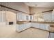 Bright kitchen with granite countertops and white cabinets at 728 W Sandra Ter, Phoenix, AZ 85023
