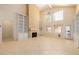 Expansive living room featuring built-in shelving, a fireplace, and large windows for natural light at 728 W Sandra Ter, Phoenix, AZ 85023