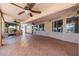 Spacious covered patio featuring ceiling fans and tiled flooring, perfect for outdoor entertaining at 728 W Sandra Ter, Phoenix, AZ 85023