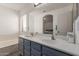 Bright bathroom boasts double sinks, a large mirror, and soaking tub for a spa-like experience at 7725 S 47Th Ln, Laveen, AZ 85339