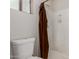 Clean bathroom with a toilet and shower stall; shower curtain rod present, but curtain is absent at 7725 S 47Th Ln, Laveen, AZ 85339