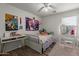 Bright bedroom with a ceiling fan, desk, and carpet at 7725 S 47Th Ln, Laveen, AZ 85339