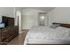Spacious bedroom featuring wood floors, a closet, and an en-suite bathroom offers comfort and style at 7725 S 47Th Ln, Laveen, AZ 85339
