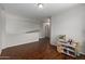 Bonus room with hardwood floors, and light neutral walls at 7725 S 47Th Ln, Laveen, AZ 85339
