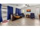 Cozy living room featuring tile floors, ceiling fan, comfortable seating, and lots of light at 7725 S 47Th Ln, Laveen, AZ 85339