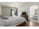 Spacious main bedroom with a vaulted ceiling and an ensuite bathroom at 7725 S 47Th Ln, Laveen, AZ 85339