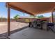 Relaxing covered patio with a built-in barbecue area, perfect for outdoor entertaining at 7725 S 47Th Ln, Laveen, AZ 85339