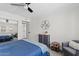 Bright bedroom features a ceiling fan, seating area, and ample closet space at 7920 E Camelback Rd # 508, Scottsdale, AZ 85251