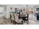 Open dining area with a view of the living room and large windows is light and bright at 7920 E Camelback Rd # 508, Scottsdale, AZ 85251