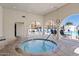 Relaxing community hot tub with architectural arches, exterior pool and seating at 7920 E Camelback Rd # 508, Scottsdale, AZ 85251
