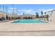 Community pool featuring ample seating, large umbrellas and lush landscaping at 7920 E Camelback Rd # 508, Scottsdale, AZ 85251