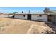 Expansive backyard featuring dirt, potential for landscaping, and access to the home at 8202 W Turney Ave, Phoenix, AZ 85033
