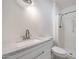 Bright bathroom featuring shower and white vanity with granite countertop at 8202 W Turney Ave, Phoenix, AZ 85033
