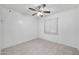 Bright bedroom with tile flooring, white walls, and a window with blinds at 8202 W Turney Ave, Phoenix, AZ 85033