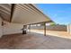 Inviting covered patio area with outdoor grill and ample space to enjoy the backyard view at 8202 W Turney Ave, Phoenix, AZ 85033