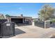 Well-kept front yard with covered parking and a charming single-story residence and blue sky at 8202 W Turney Ave, Phoenix, AZ 85033