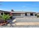 Inviting front yard featuring a charming fountain and well-maintained landscaping at 8202 W Turney Ave, Phoenix, AZ 85033