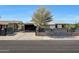Charming single-story home featuring a well-maintained front yard and a driveway with covered parking at 8202 W Turney Ave, Phoenix, AZ 85033