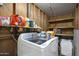 Laundry Room featuring new washer and dryer units and plenty of storage space at 8202 W Turney Ave, Phoenix, AZ 85033