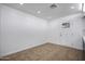 Bright, minimalist room with neutral walls and a door that provides natural light and access at 8202 W Turney Ave, Phoenix, AZ 85033