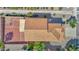 Aerial view of the house showing the roof, backyard with gravel, and surrounding landscape at 885 E Lakeview Dr, San Tan Valley, AZ 85143