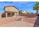Open backyard featuring a fire pit, rock landscaping, a patio, and block fence for privacy at 885 E Lakeview Dr, San Tan Valley, AZ 85143