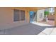 Covered patio with sliding glass door, light, and AC unit overlooking the backyard at 885 E Lakeview Dr, San Tan Valley, AZ 85143