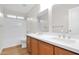 Modern bathroom featuring double sinks, sleek cabinetry, and a bathtub with shower at 885 E Lakeview Dr, San Tan Valley, AZ 85143