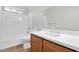 Bathroom features a tub/shower combination with a vanity with wood cabinets and white countertop at 885 E Lakeview Dr, San Tan Valley, AZ 85143