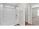 Bright bathroom with a shower-tub combo and view into the adjacent bedroom at 885 E Lakeview Dr, San Tan Valley, AZ 85143