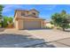 Two-story home with neutral stucco, tile roof, desert landscaping, and a two car garage at 885 E Lakeview Dr, San Tan Valley, AZ 85143