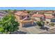 Two-story home with neutral stucco, tile roof, desert landscaping, and a two car garage at 885 E Lakeview Dr, San Tan Valley, AZ 85143