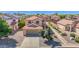 Two-story home with neutral stucco, tile roof, desert landscaping, and a two car garage at 885 E Lakeview Dr, San Tan Valley, AZ 85143