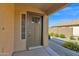 Inviting front entrance with a decorative door, sidelight window, and gravel landscaping at 885 E Lakeview Dr, San Tan Valley, AZ 85143