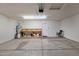 Spacious garage with workbench, storage shelves, water heater, and finished drywall at 885 E Lakeview Dr, San Tan Valley, AZ 85143