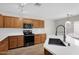 Well-equipped kitchen featuring wood cabinets, subway tile backsplash, and stainless steel appliances at 885 E Lakeview Dr, San Tan Valley, AZ 85143
