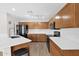 Beautiful kitchen with wood cabinets, modern appliances, and ample counter space at 885 E Lakeview Dr, San Tan Valley, AZ 85143