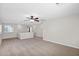 Expansive loft space with a ceiling fan and plenty of natural light, perfect for flexible living at 885 E Lakeview Dr, San Tan Valley, AZ 85143
