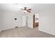 Spacious main bedroom with a ceiling fan, ensuite bathroom access, and carpeted flooring at 885 E Lakeview Dr, San Tan Valley, AZ 85143