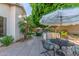 Outdoor kitchen with stainless steel grill and countertop bar for entertaining in this spacious backyard at 9326 E Princess Dr, Mesa, AZ 85207
