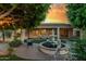 Beautiful backyard with a charming fountain, lush landscaping, and a cozy seating area at 9326 E Princess Dr, Mesa, AZ 85207
