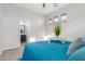Bright bedroom featuring a blue bedspread and an ensuite bathroom at 9326 E Princess Dr, Mesa, AZ 85207