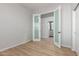 Neutral bedroom with wood-look floors and French doors at 9326 E Princess Dr, Mesa, AZ 85207