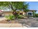 Charming single-story home with xeriscaped front yard and desert-friendly landscaping at 9326 E Princess Dr, Mesa, AZ 85207