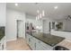 Gourmet kitchen features a center island, stainless steel appliances, and ample storage at 9326 E Princess Dr, Mesa, AZ 85207