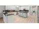 Modern kitchen boasts sleek cabinetry, dark countertops, and stainless steel appliances at 9326 E Princess Dr, Mesa, AZ 85207