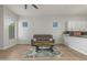 Relaxing living room with plank flooring, comfortable seating, and easy access to the kitchen at 9326 E Princess Dr, Mesa, AZ 85207